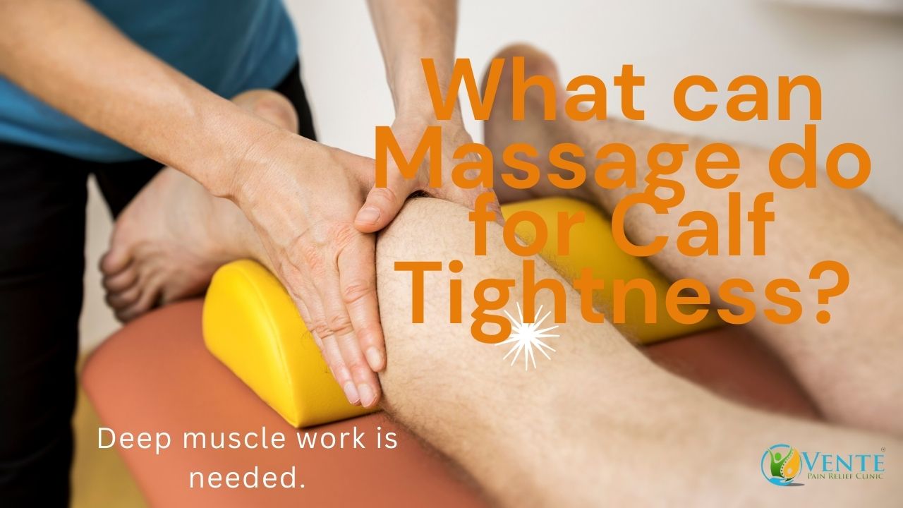 Therapist massaging a patient's calf on a massage table.